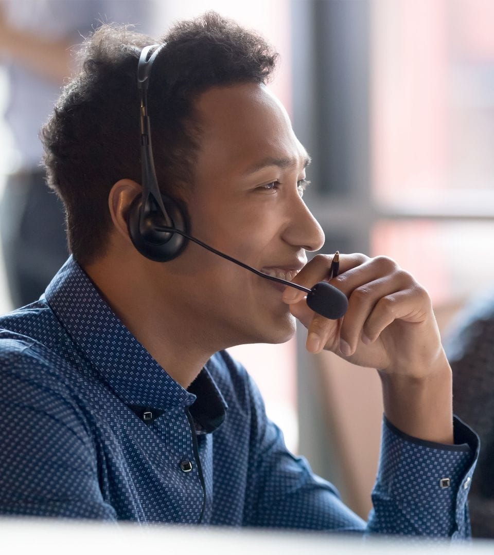 one male person talking to customers over the phone