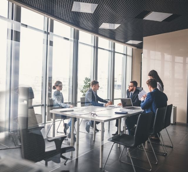 conference room with 5 people sitting together