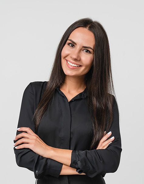 woman with folded arms looking at the camera