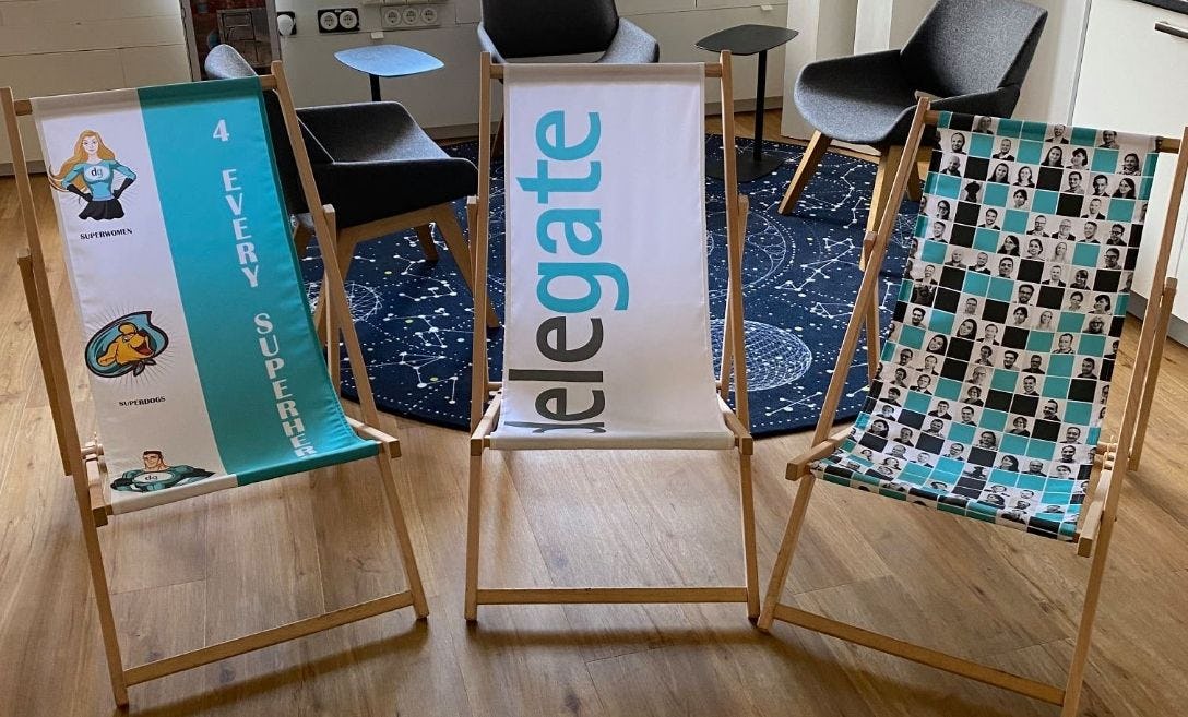 breakroom with 3 chairs showing delegate logos
