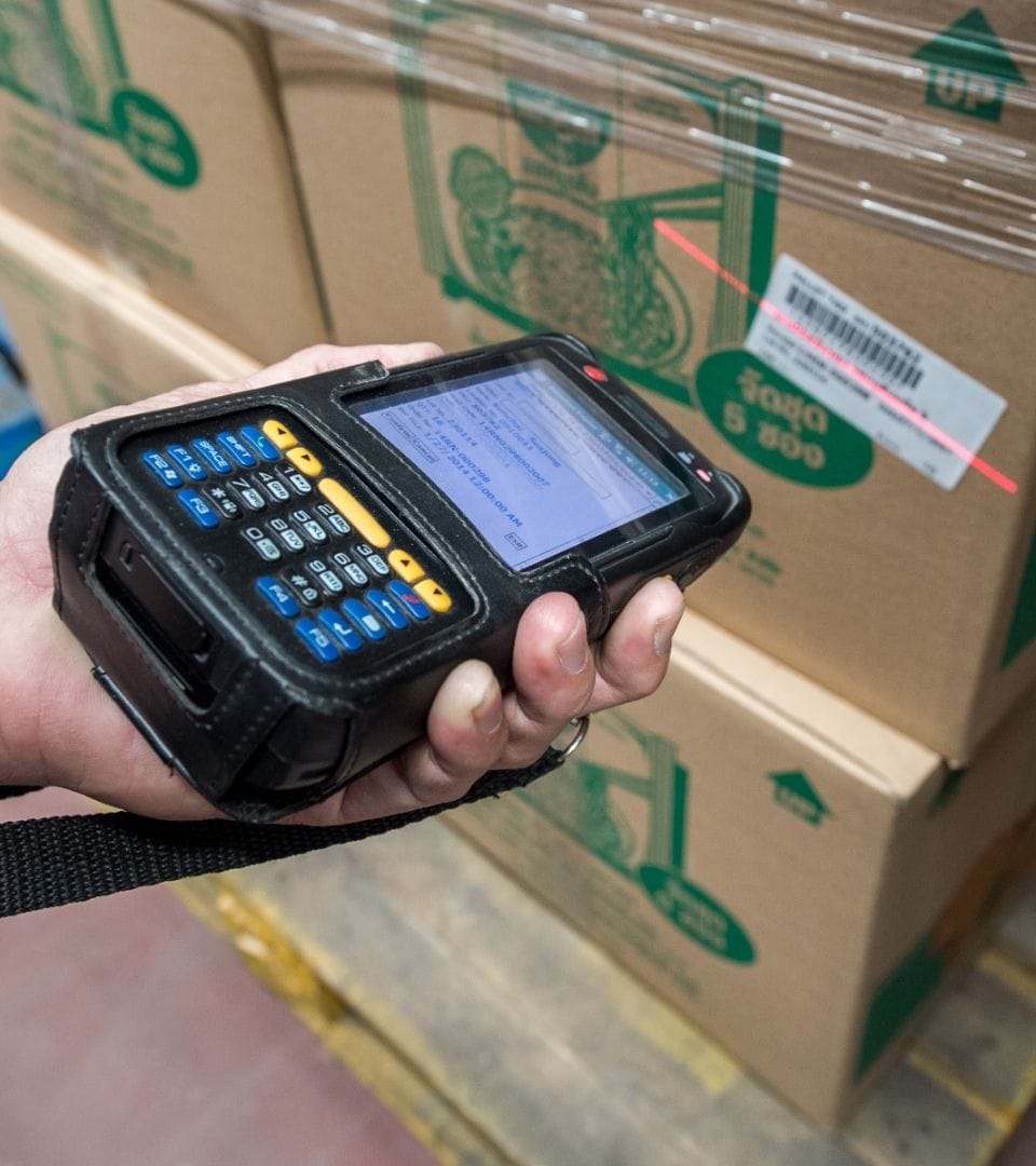 person scanning a box with food to automate processes