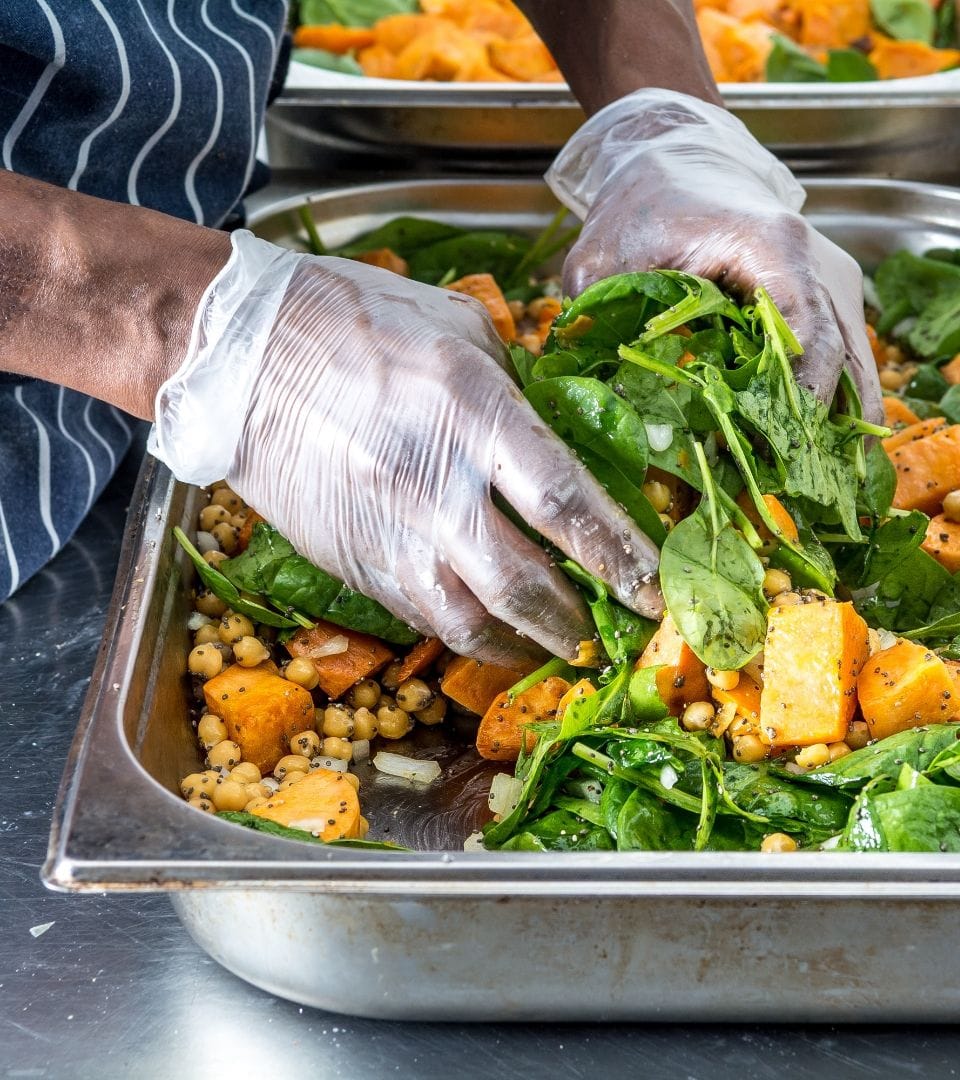 male preparing food for catering